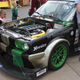 A boy at Fan Fest stares at the big engine under the E30's hood.